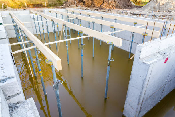 Construction site with flooded foundation for house stock photo