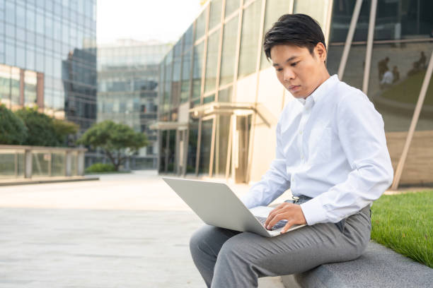 istock Young man using his laptop to look for a new job 1279808299