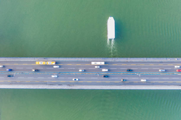 istock High angle view of boat and traffic on bridge 1279808523