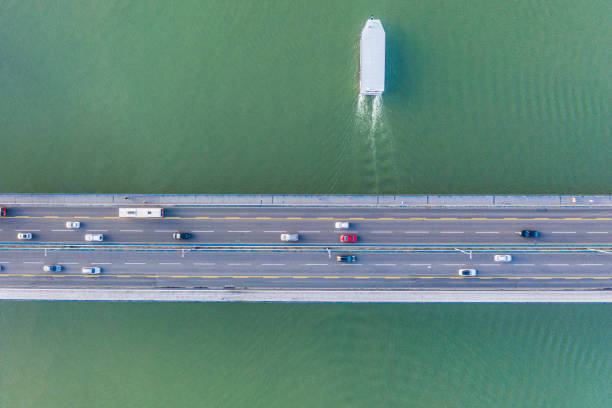 istock High angle view of boat and traffic on bridge 1279808650