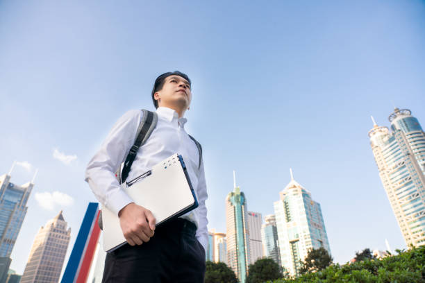 Young man walking in business district