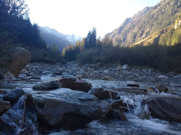 istock river in alps at sunrise in autumn 1279809776