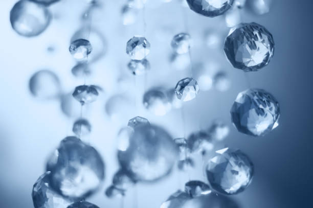 istock Abstract blue round defocused cristals background. Blur lights. 1279809992