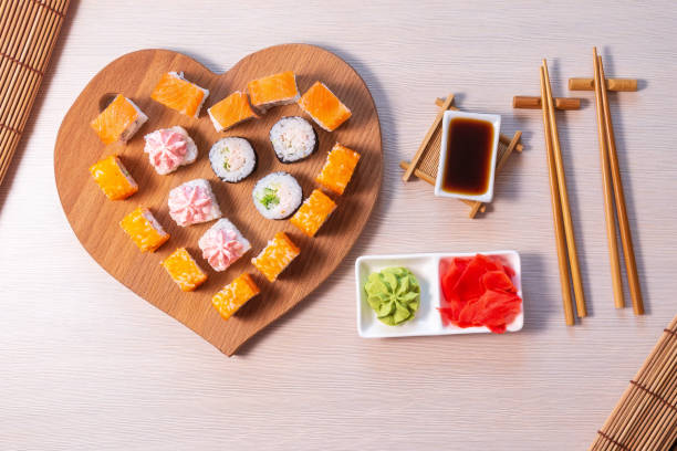 istock valentines day. Rolls stacked, soy sauce and sticks 1279810030