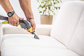 Chemical sofa depth cleaning by a professional