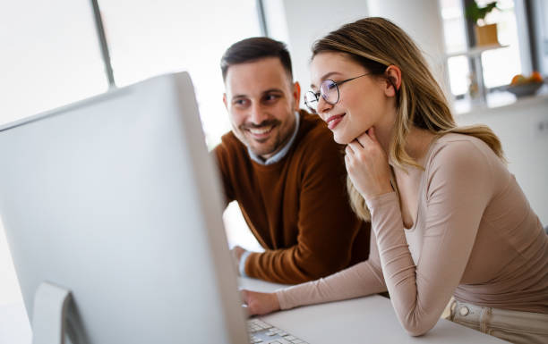 istock Business people having fun and chatting at workplace office 1279812829