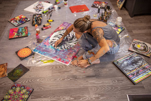 istock Creative woman painting on the floor 1279812940
