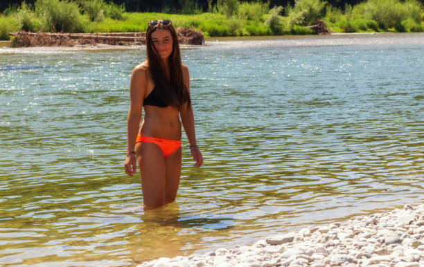 istock a young woman is having fun on the isar river in munich 1279813087