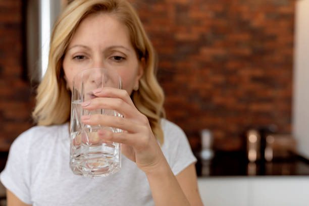istock Woman drinking water 1279813926