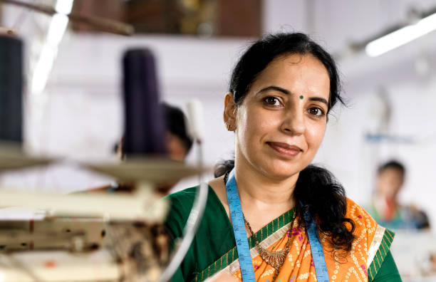 istock Indian woman textile worker on production line 1279816457