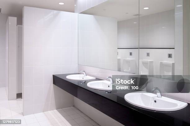 Perspective Of Men Restroom Stock Photo - Download Image Now - Toilet, Bathroom, Modern