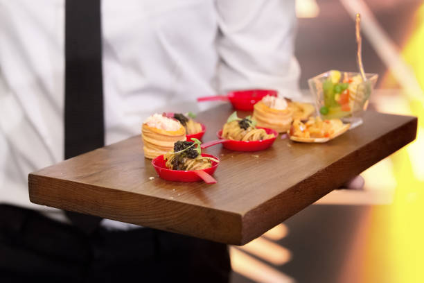 istock Waiter serve canape selection on slate wooden platter 1279817230