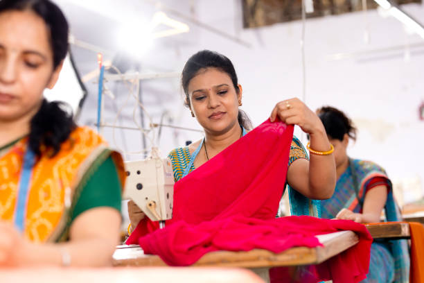 istock Indian woman textile worker on production line 1279817319