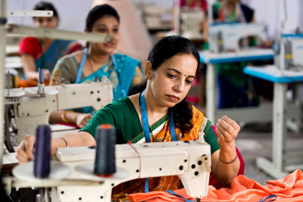 istock Indian woman textile worker on production line 1279817453