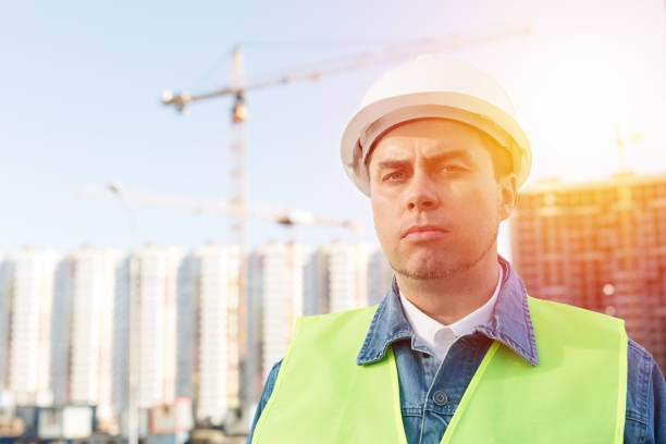 istock Worker staff or engineer in white protective helmet at construction site 1279817612