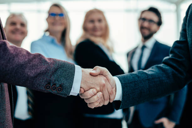 istock close up. business handshake on an office background 1279817764