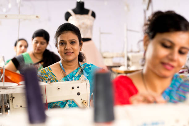 istock Indian woman textile worker on production line 1279818996