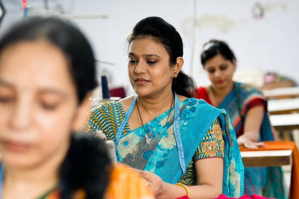 istock Indian woman textile worker on production line 1279820019
