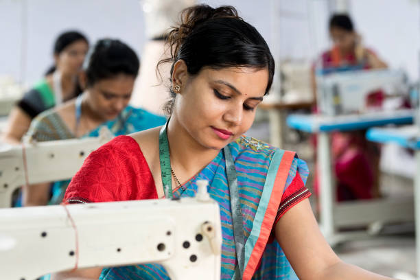 istock Indian woman textile worker on production line 1279820131