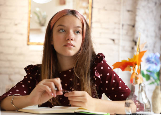 istock young beautiful girl sitting relaxing and thinking 1279820170