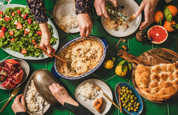 istock People eating Turkish dinner with lamb over green tile table 1279824707