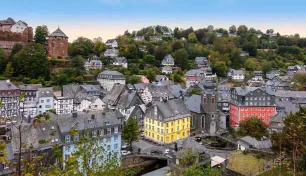 Aerial view of historic town with colorful houses in Monschau, Eifel, Germany.	Blue sky on a beautiful morning.