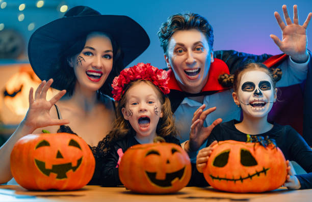 istock Happy family celebrating Halloween 1279825817