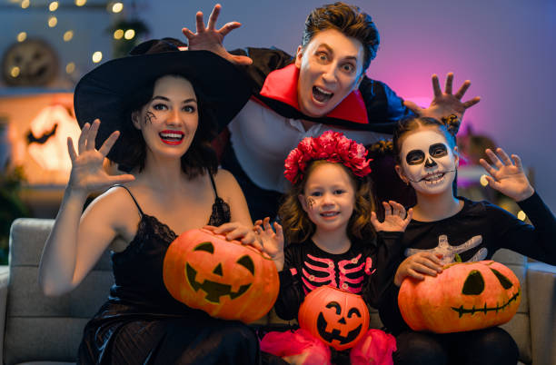 istock Happy family celebrating Halloween 1279825821