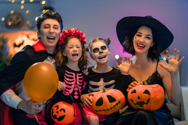 istock Happy family celebrating Halloween 1279825862
