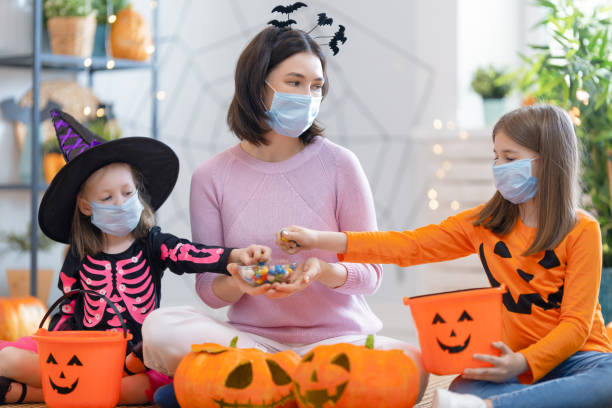 istock Happy family celebrating Halloween 1279828589