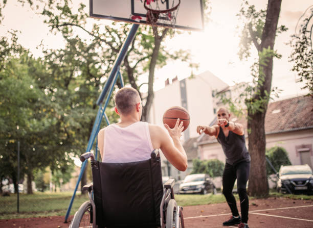 istock Disabled men playing basketball with friends 1279828673