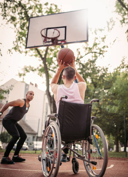 istock Disabled men playing basketball with friends 1279828904