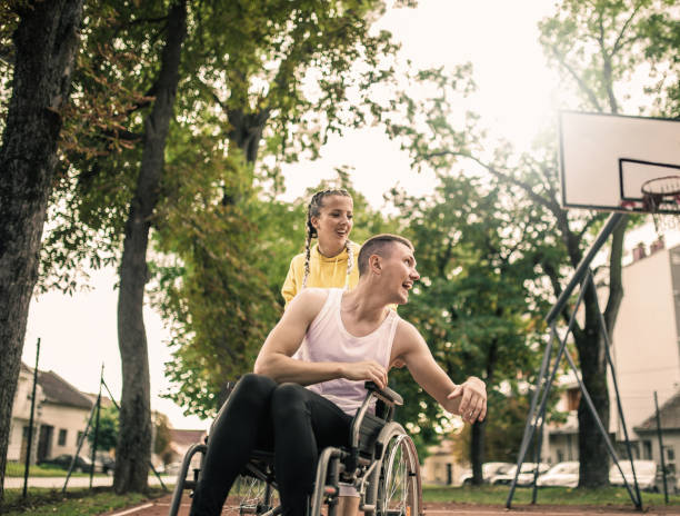 istock Disabled men playing basketball with friends 1279829062