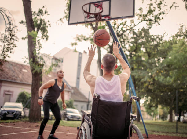 istock Disabled men playing basketball with friends 1279829161