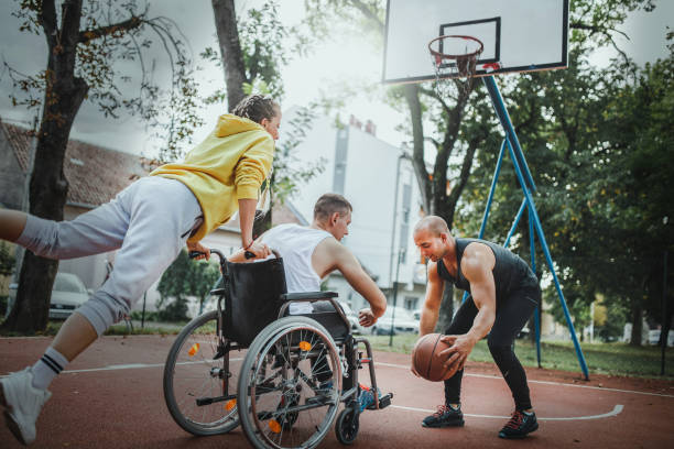 istock Disabled men playing basketball with friends 1279829174