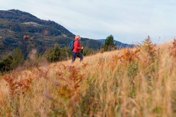 istock Mature woman out on a solo hike 1279830046