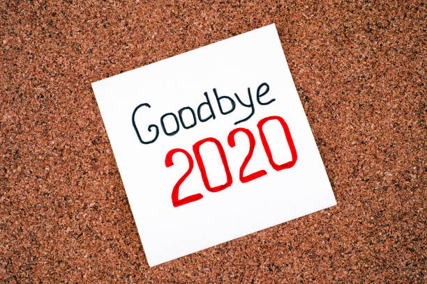istock Paper note with words Goodbye 2020 on corkboard background. 1279830572