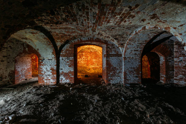 istock Dark and creepy vaulted red brick dungeon 1279831220