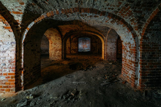 istock Dark and creepy vaulted red brick dungeon 1279831221