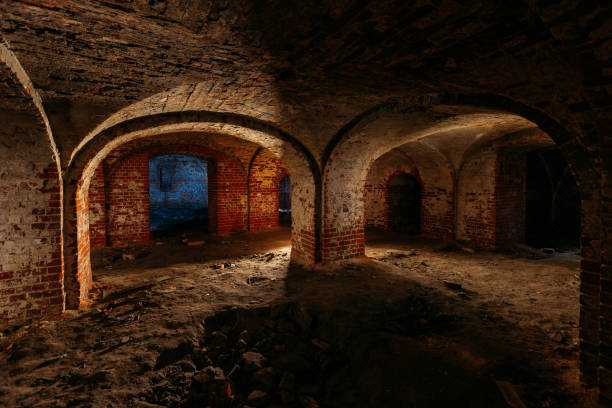 istock Dark and creepy vaulted red brick dungeon 1279831222