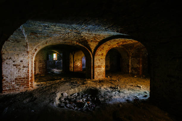istock Dark and creepy vaulted red brick dungeon 1279831228