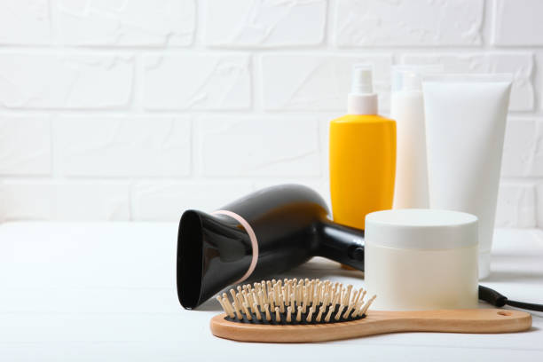 istock hair care products and a comb on the table. 1279831777