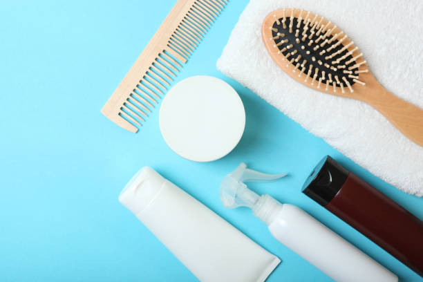 istock hair care products and a comb on the table. 1279832446
