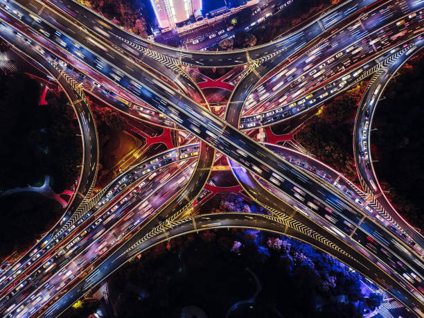istock Drone Point View of Overpass and City Traffic at Night 1279832829