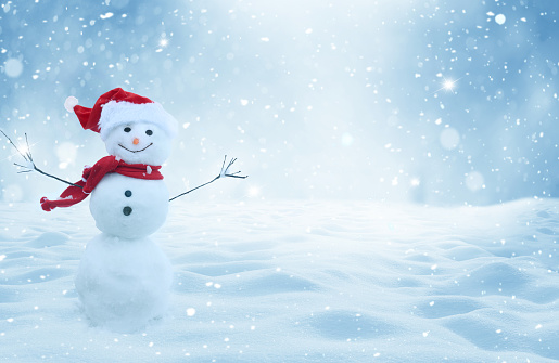 Happy  snowman standing in christmas landscape.Snow background.Winter fairytale.Merry christmas and happy new year greeting card with copy-space.