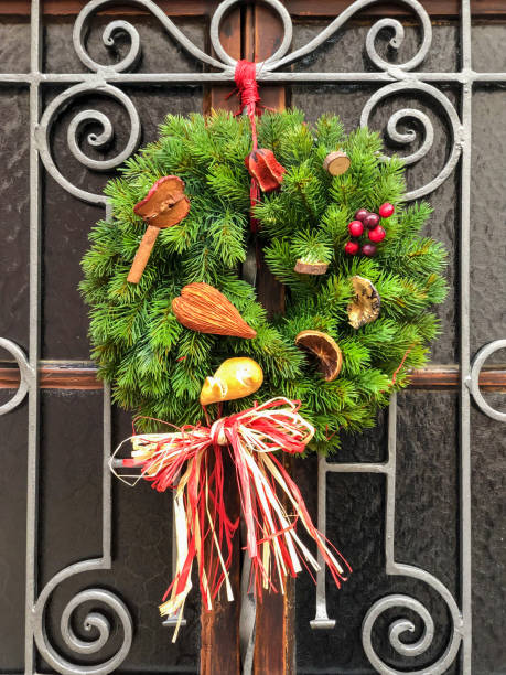 istock door decorated with pine tree branches for new year 1279834424
