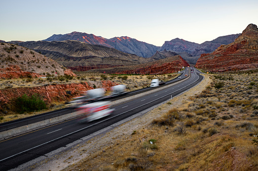 Freeway traffic on desert landscape