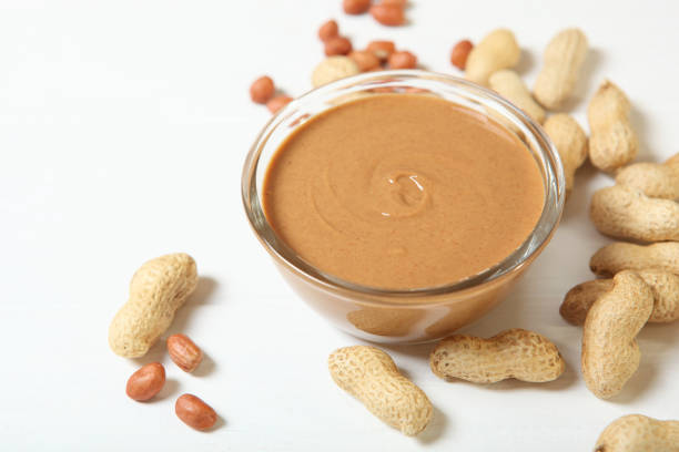 istock creamy peanut butter on the table. Peanut paste. 1279835869