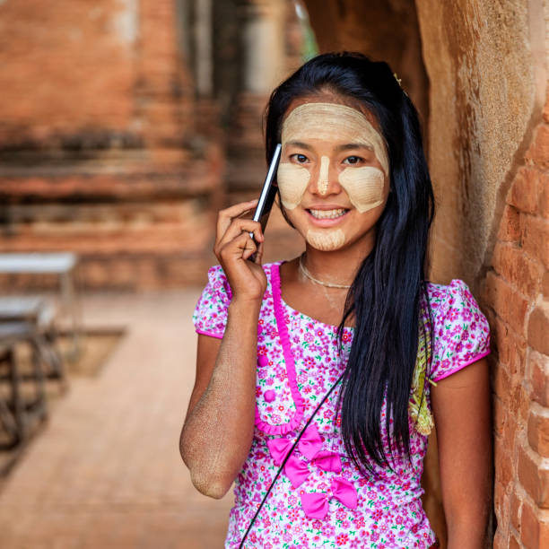 istock Young Burmese girl using a mobile phone in Bagan, Myanmar 1279838622