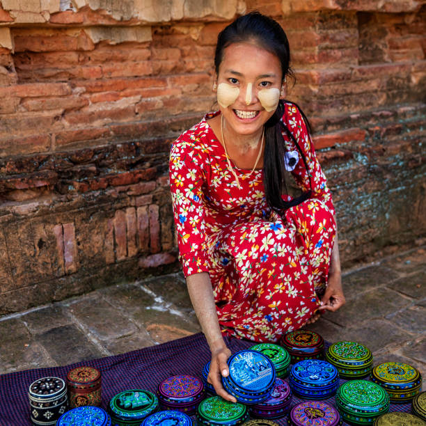 istock Young Burmese girl selling a lacquerware in Bagan, Myanmar 1279838644